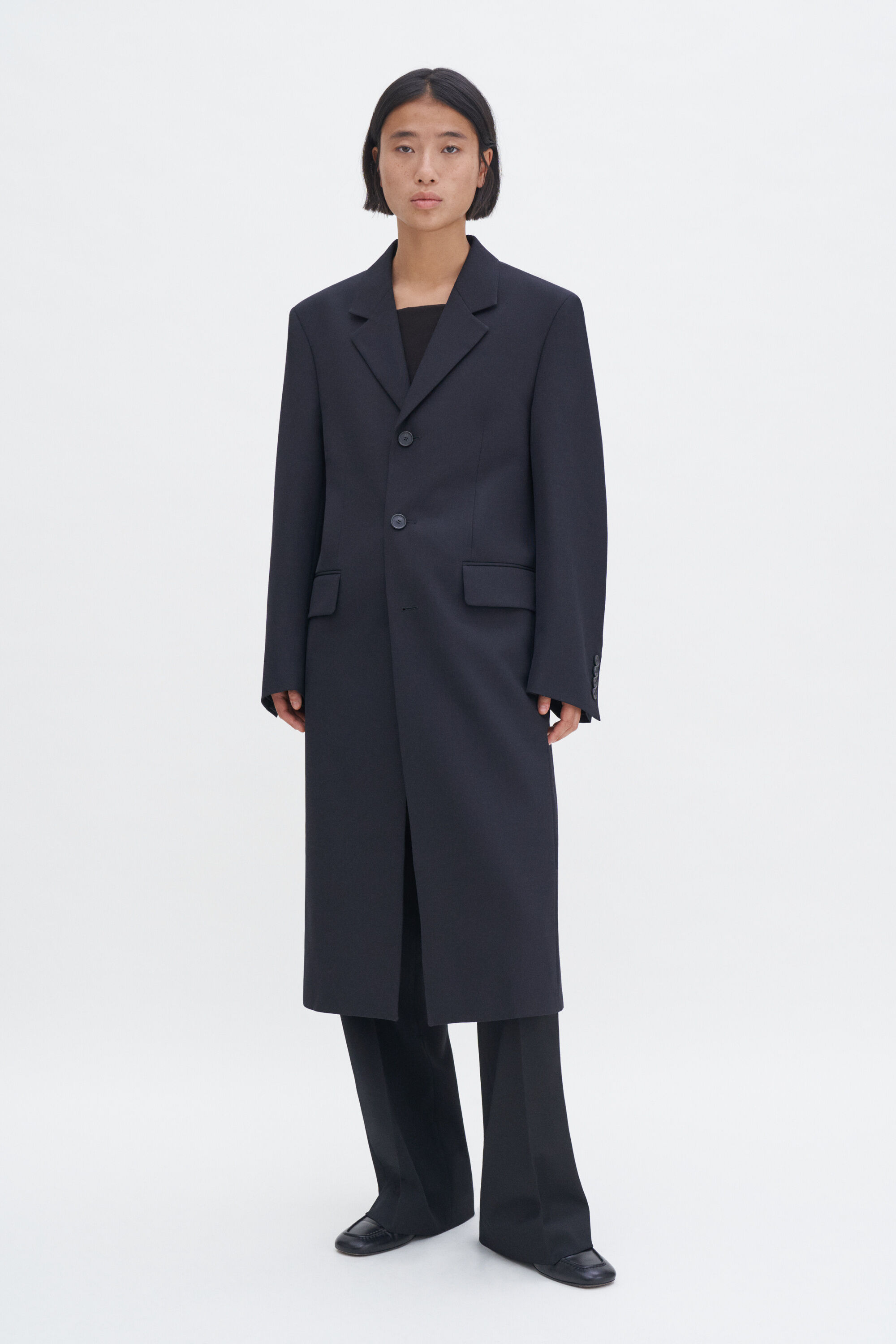 Tailored black coat top